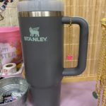 gray Stanley tumbler with a tumbler charm on it