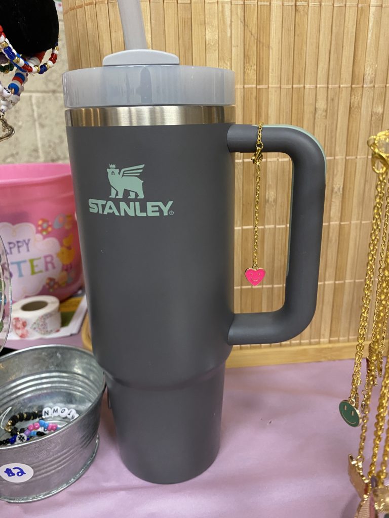 gray Stanley tumbler with a tumbler charm on it