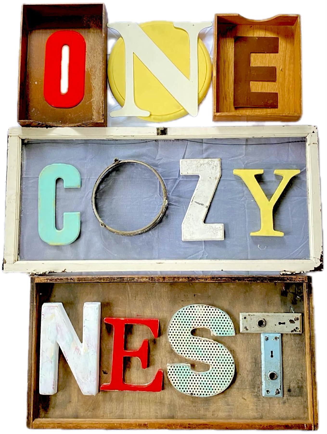 One Cozy Nest logo made up of a collection of letters made from found objects.